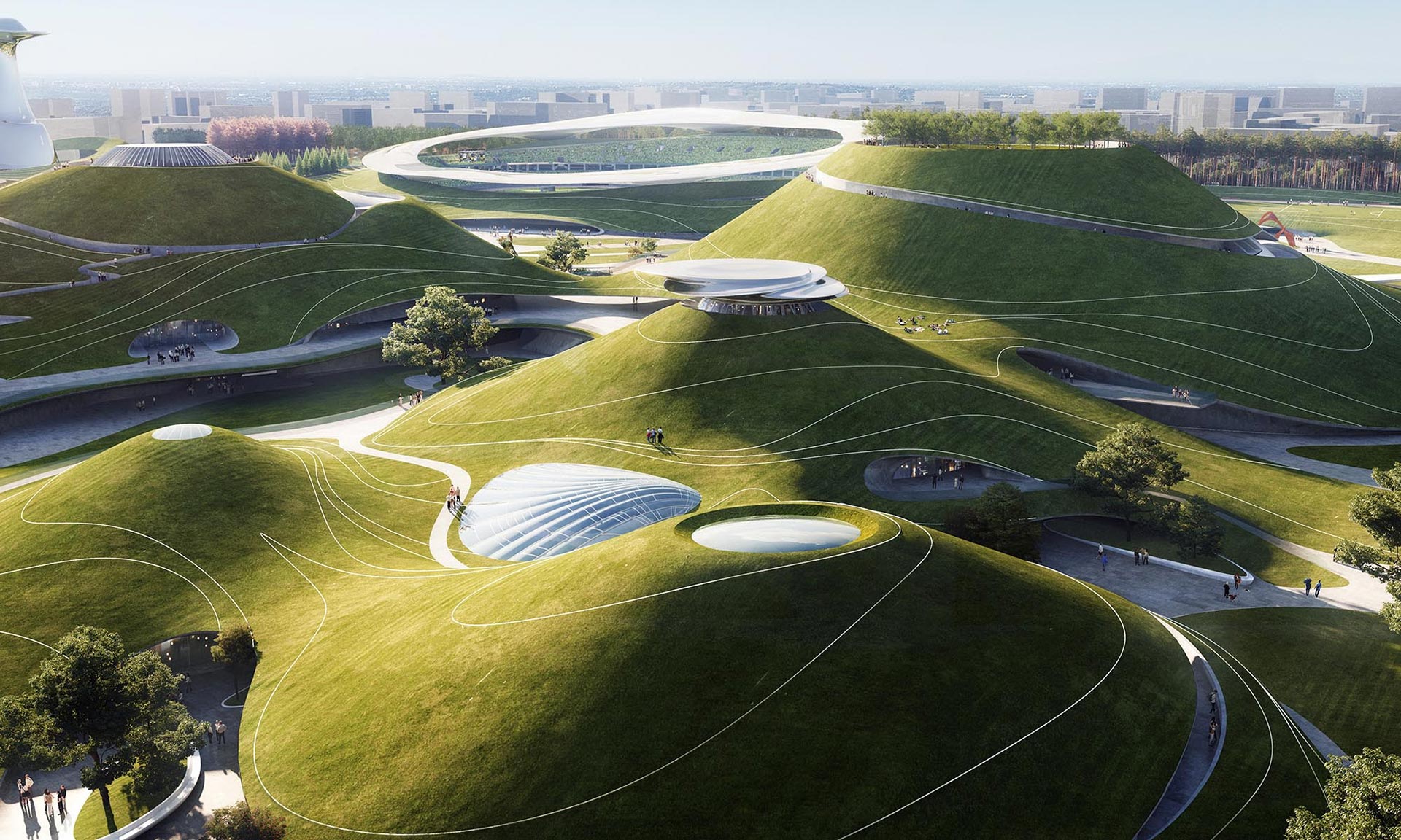 MAD staví futuristický sportovní kampus se stadiony ukrytými v zelených kopcích